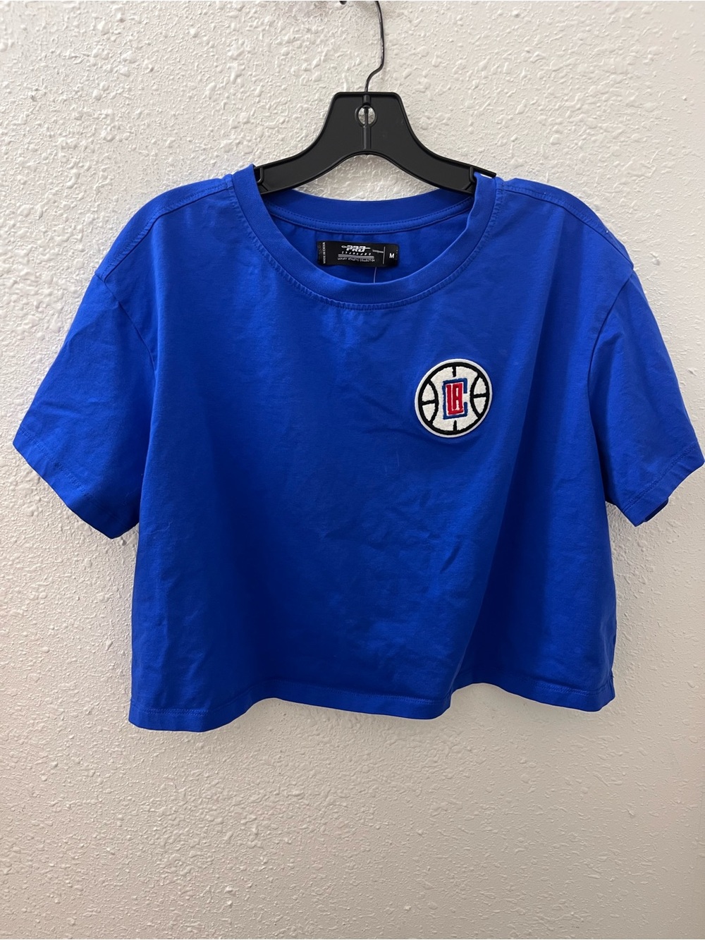 Clippers Official PRO Royal Blue Short Sleeve Cropped Tee with Team Patch